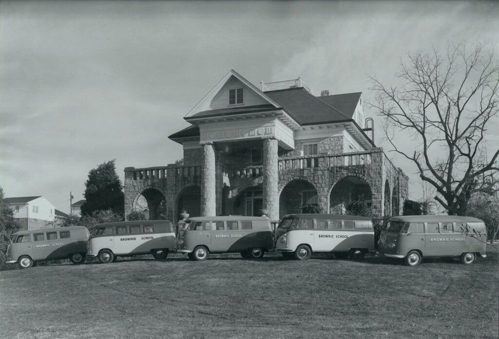 Brownie School’s historic Greystone building with its fleet of VW “buses”