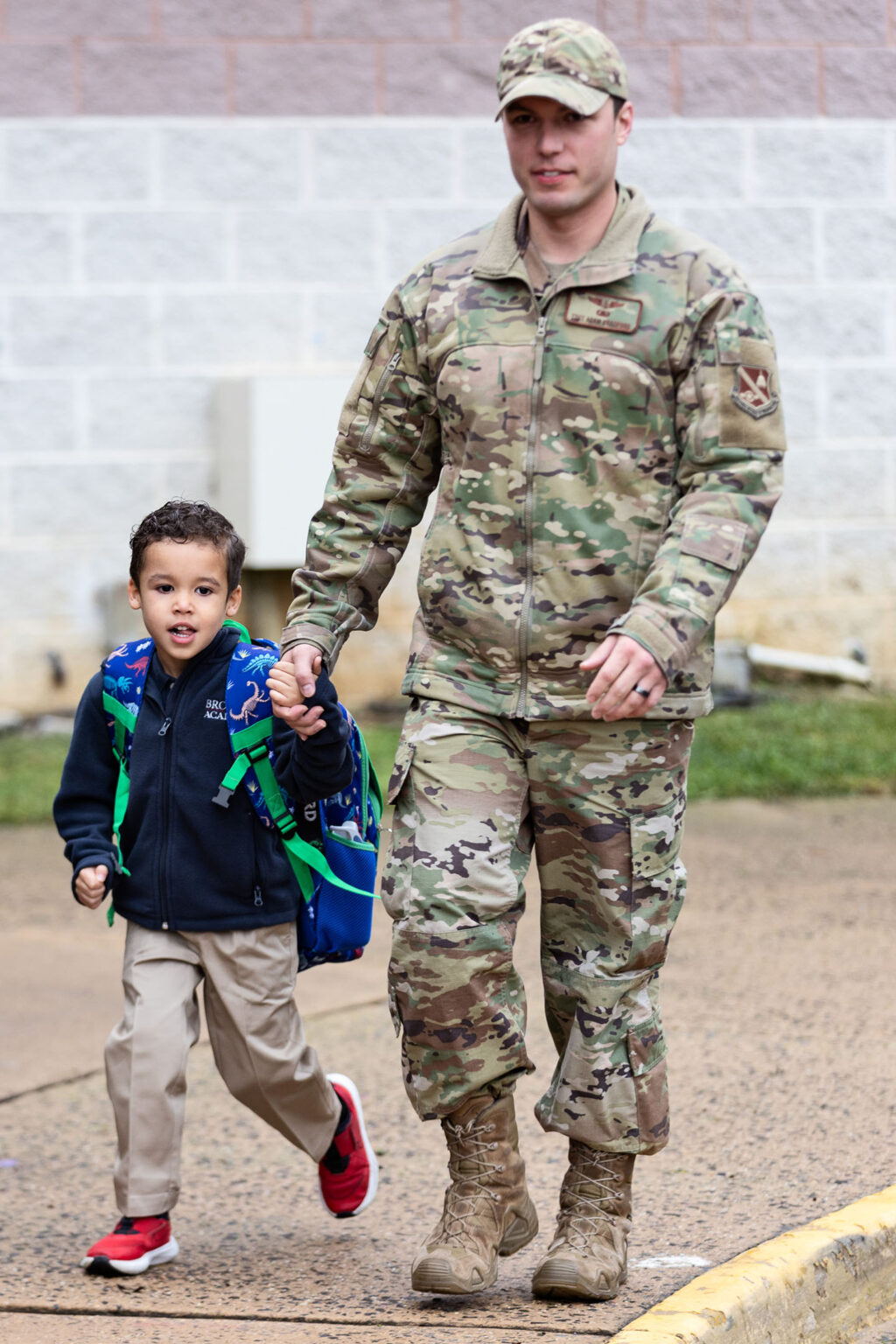 Proud military dad dropping his son off at morning arrival